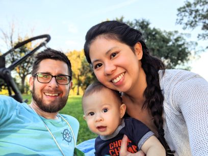 A family selfie in the park at sunset
